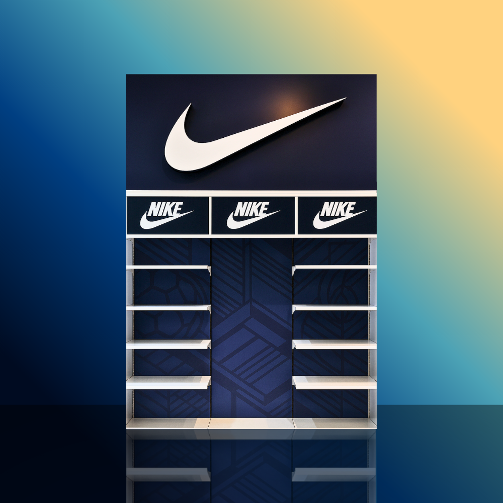 Empty Nike retail display shelf with Nike swoosh logo at the top and signage with Nike logo, set against a colorful gradient background.