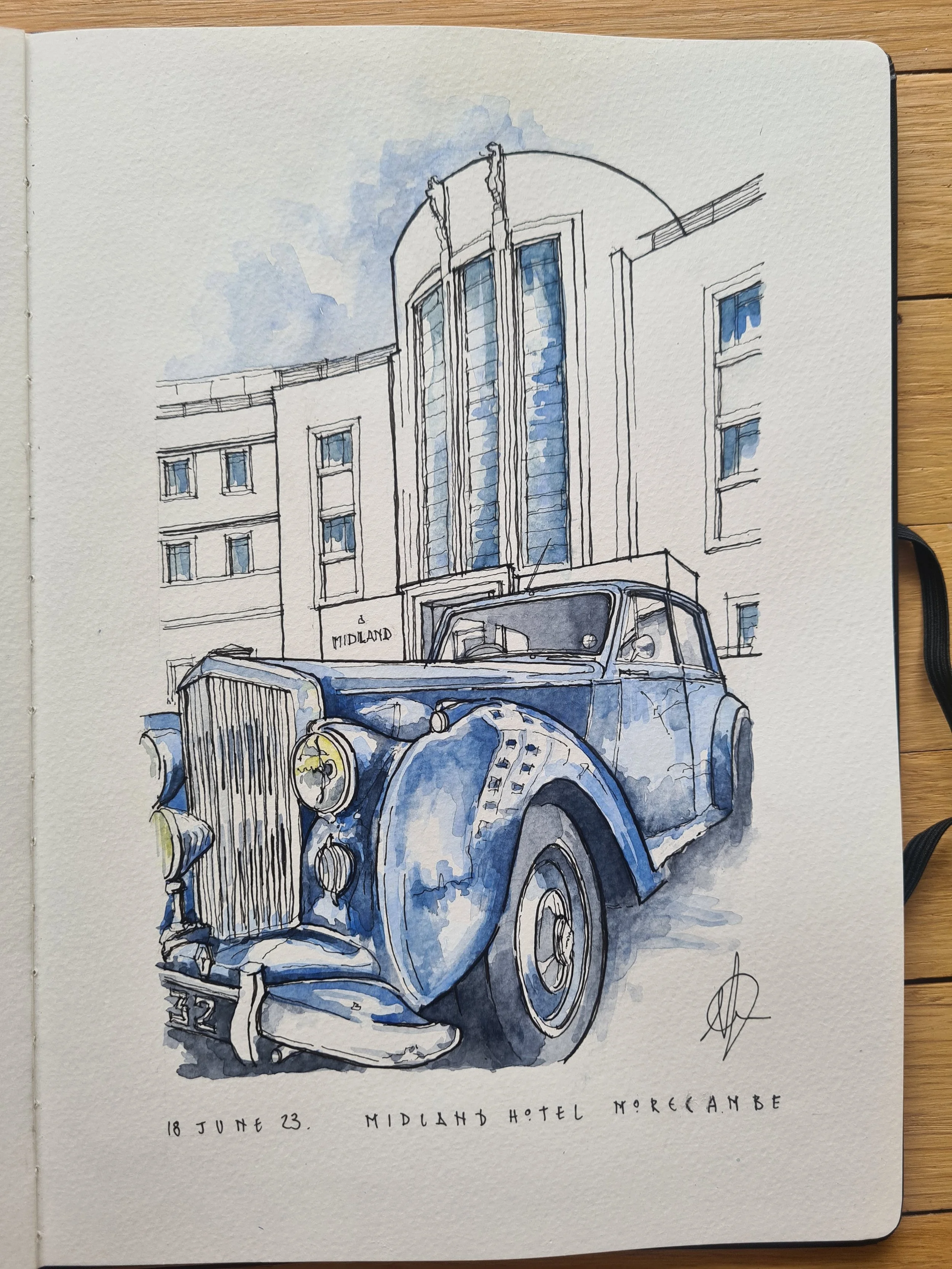 A watercolor sketch of a vintage car parked in front of the Midland Hotel in Morecambe, with the hotel's modern building in the background, dated June 18, 2023.