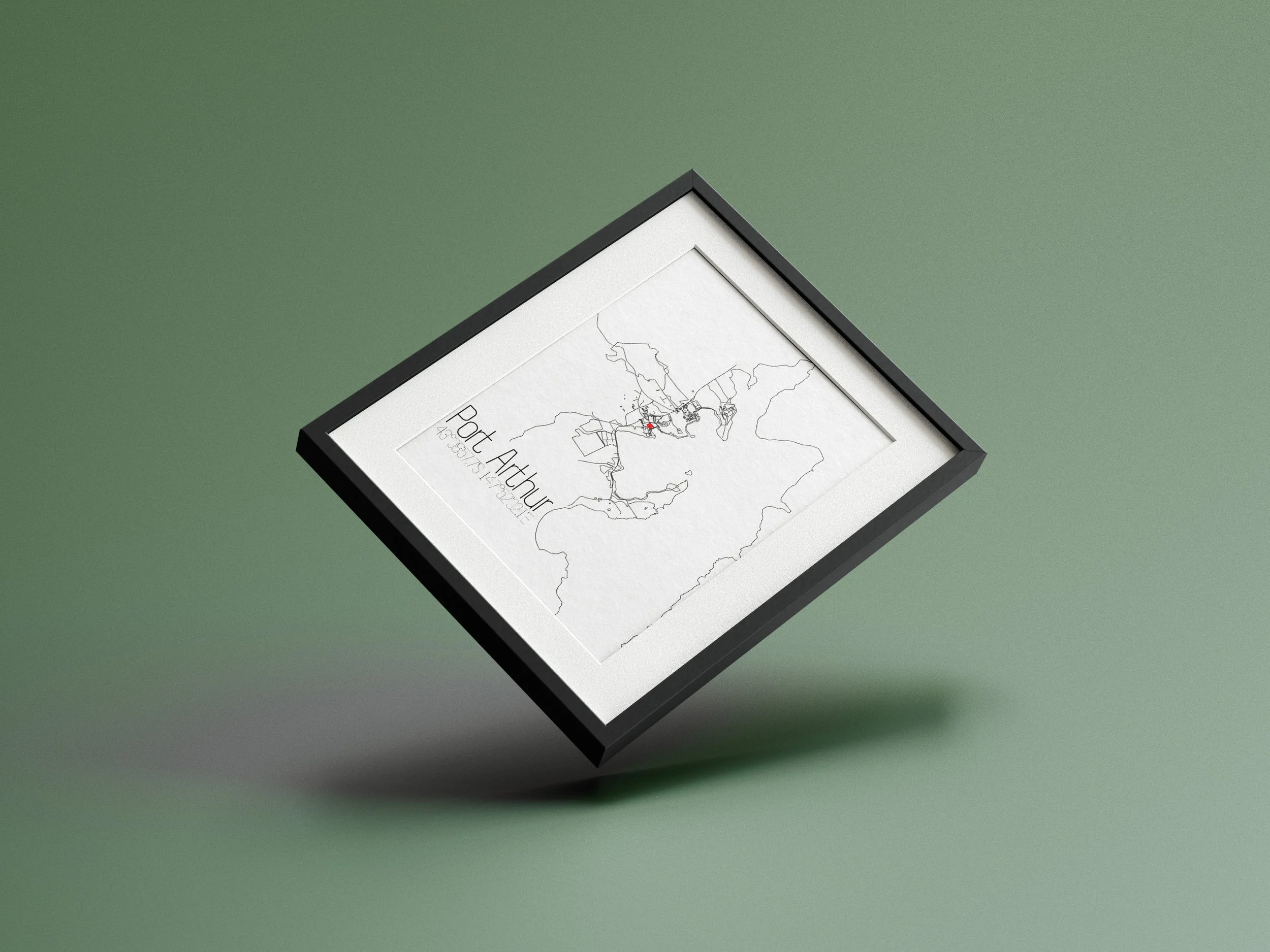 Framed minimalistic map of Port Arthur with location details, placed on a light green surface.
