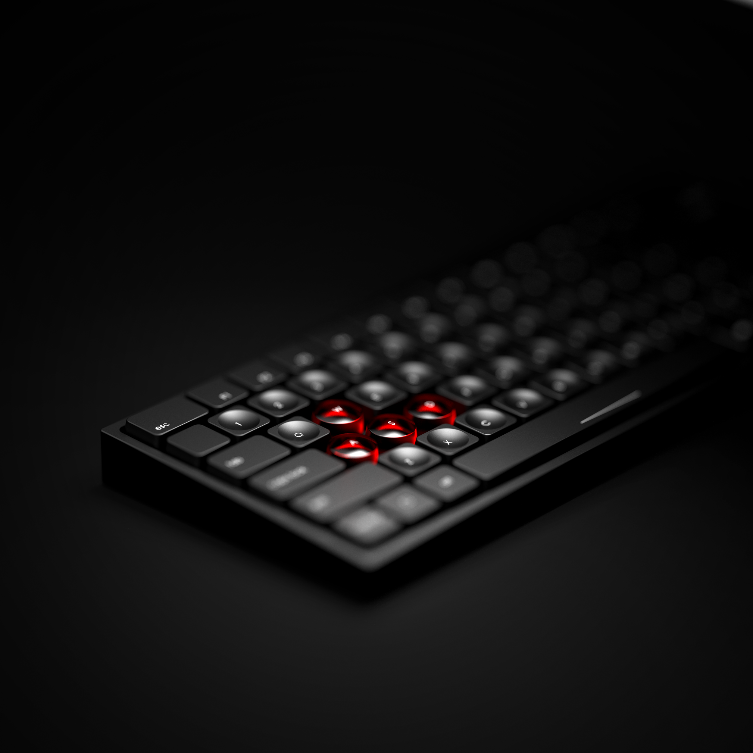Close-up of a black computer keyboard with red backlit keys in the center on a dark background.