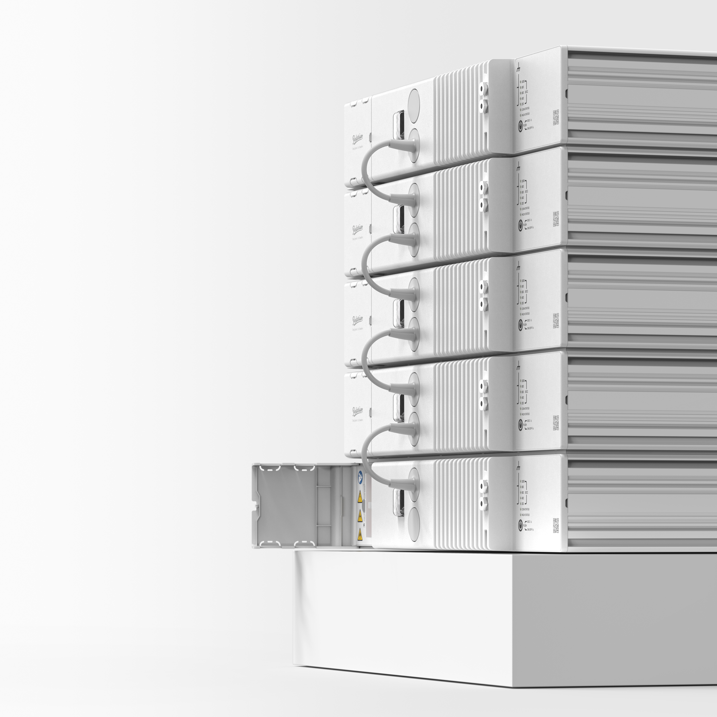 Six white electronic devices arranged vertically, with one open electrical box below them.
