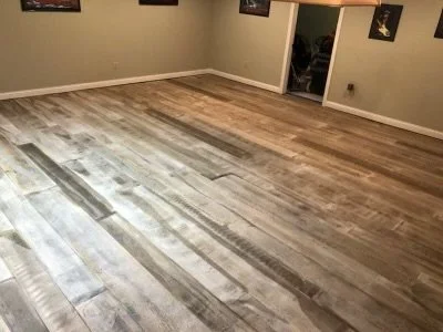 Empty living room with hardwood floors and beige walls