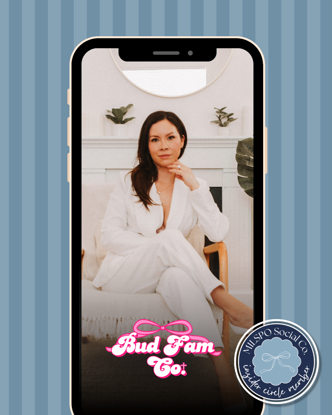 A photo of Amber Budzynski in a White chair and white power suit.