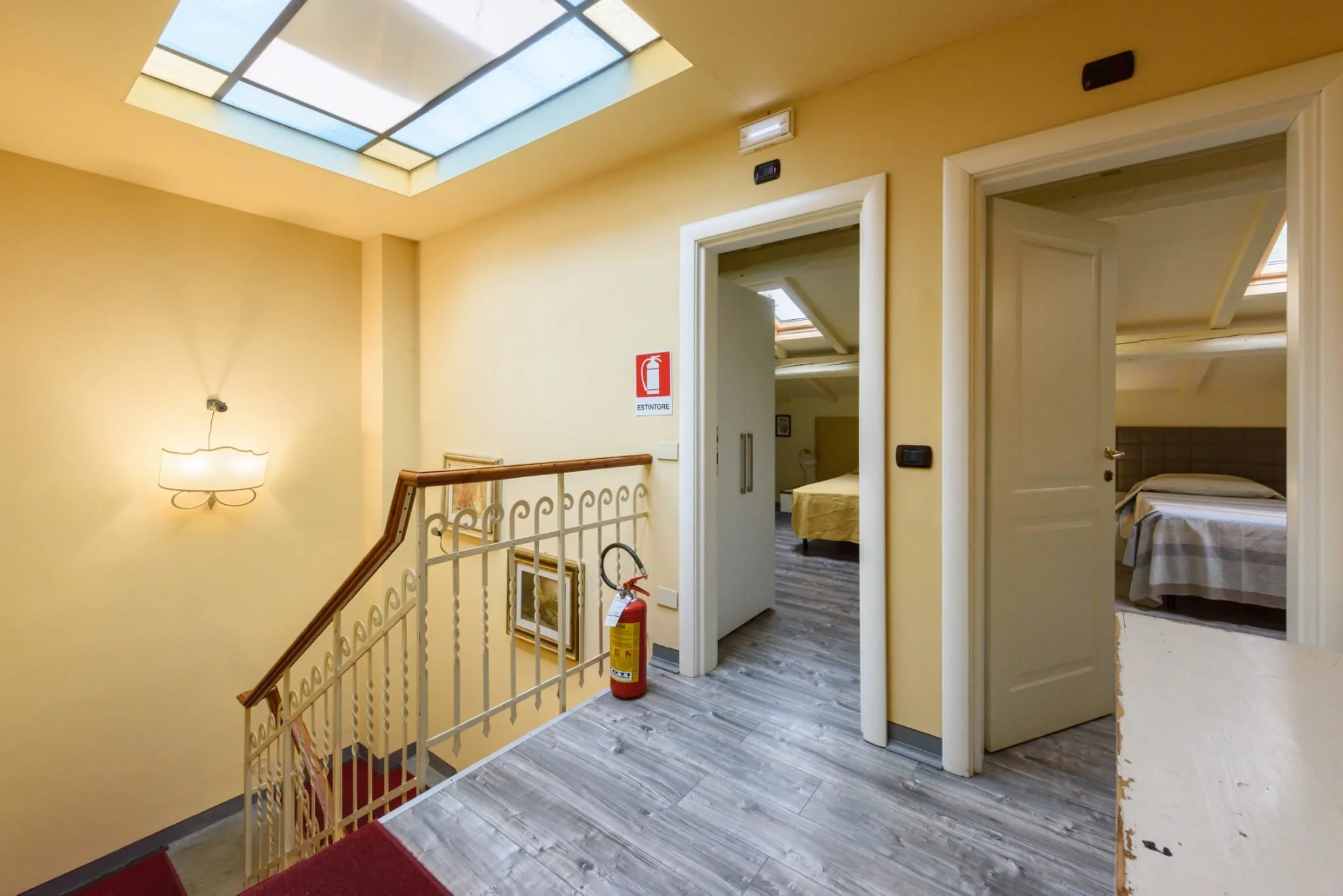 View of staircase and doors to two seperate rooms