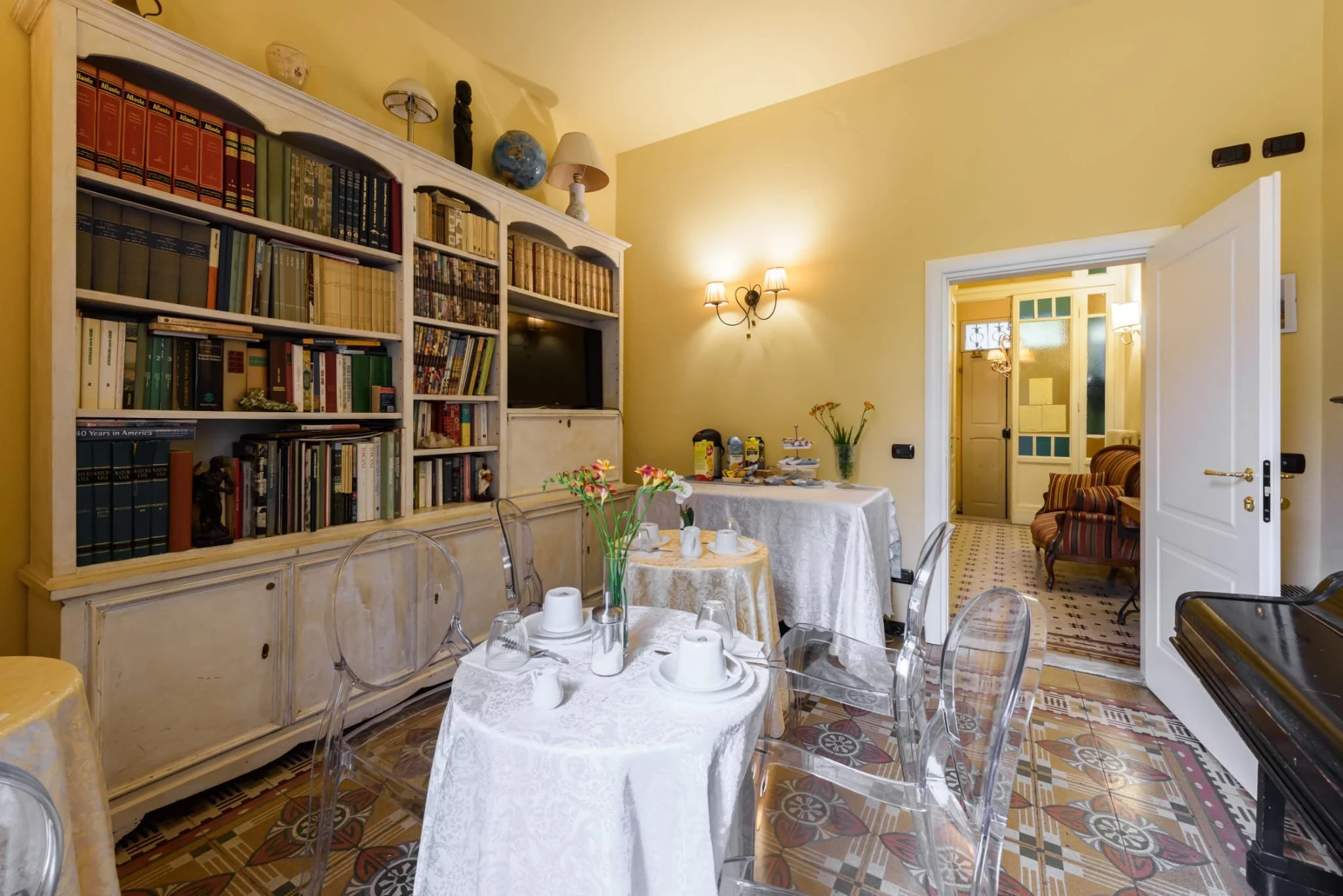 second image of dining room, this time showing the books.