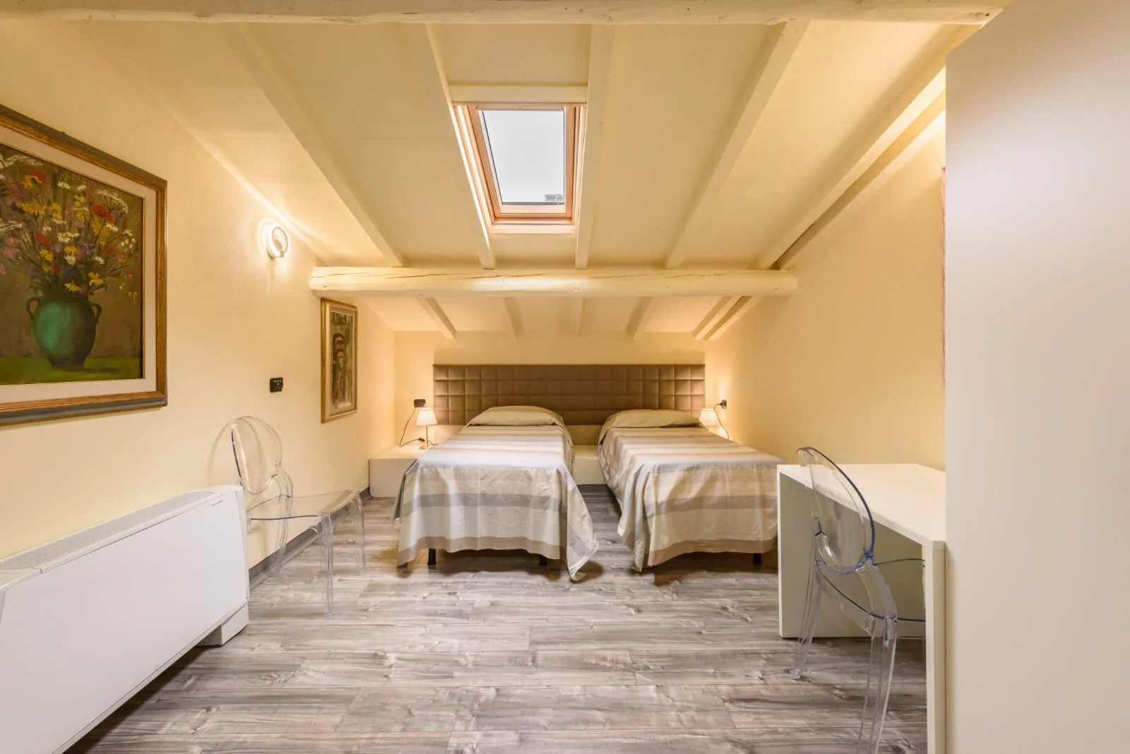 Another angle of the room with two single beds