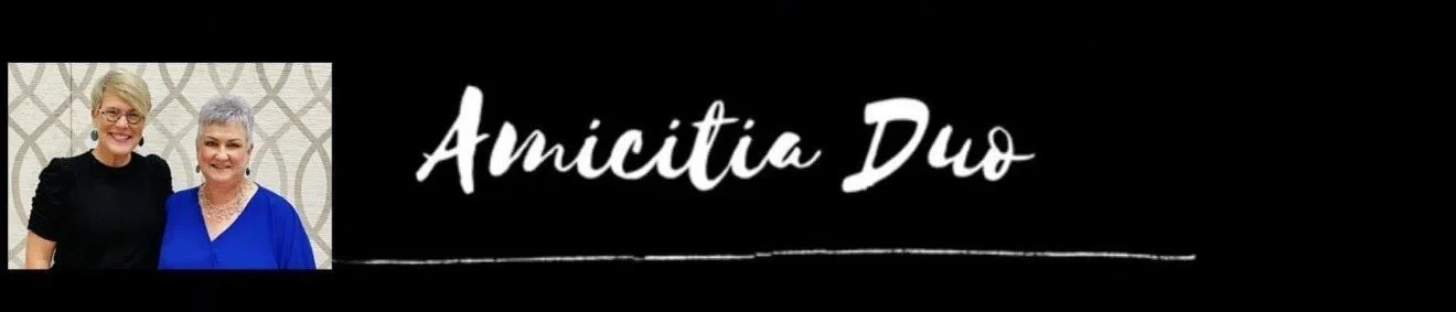 header image with the words "amicitia duo" and a photo of the performers