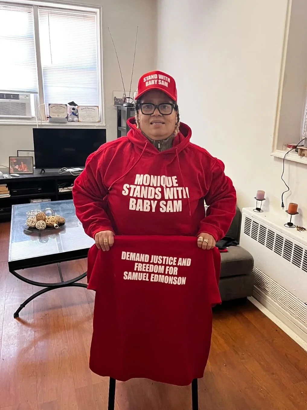 Monique wearing STAND WITH BABY SAM hoodie and hat
