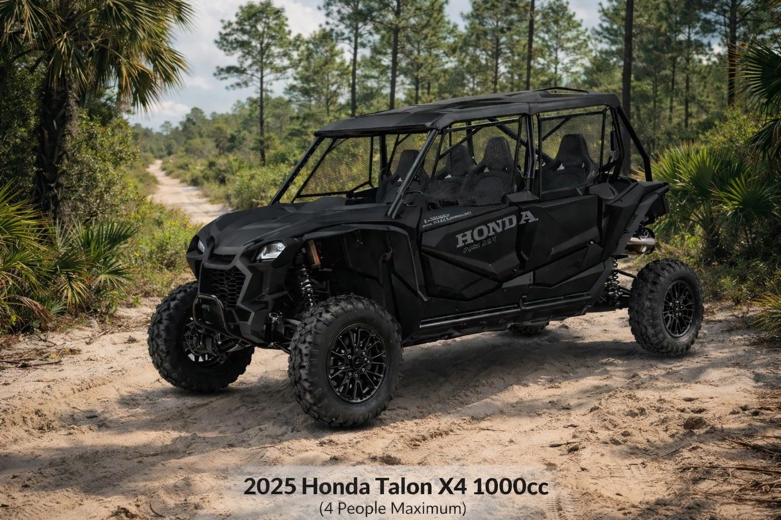 A black 2025 Honda Talon X4 1000cc utility vehicle parked on a sandy dirt trail in a tropical forest setting with green trees and bushes.