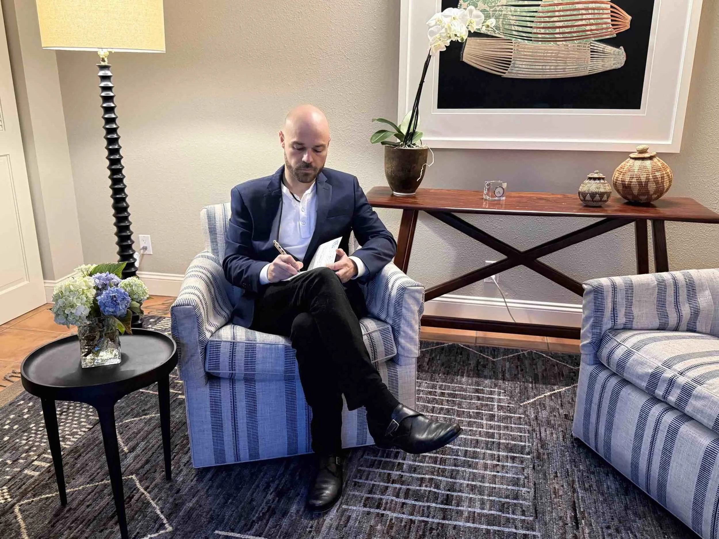 Andrew Post writing in his office