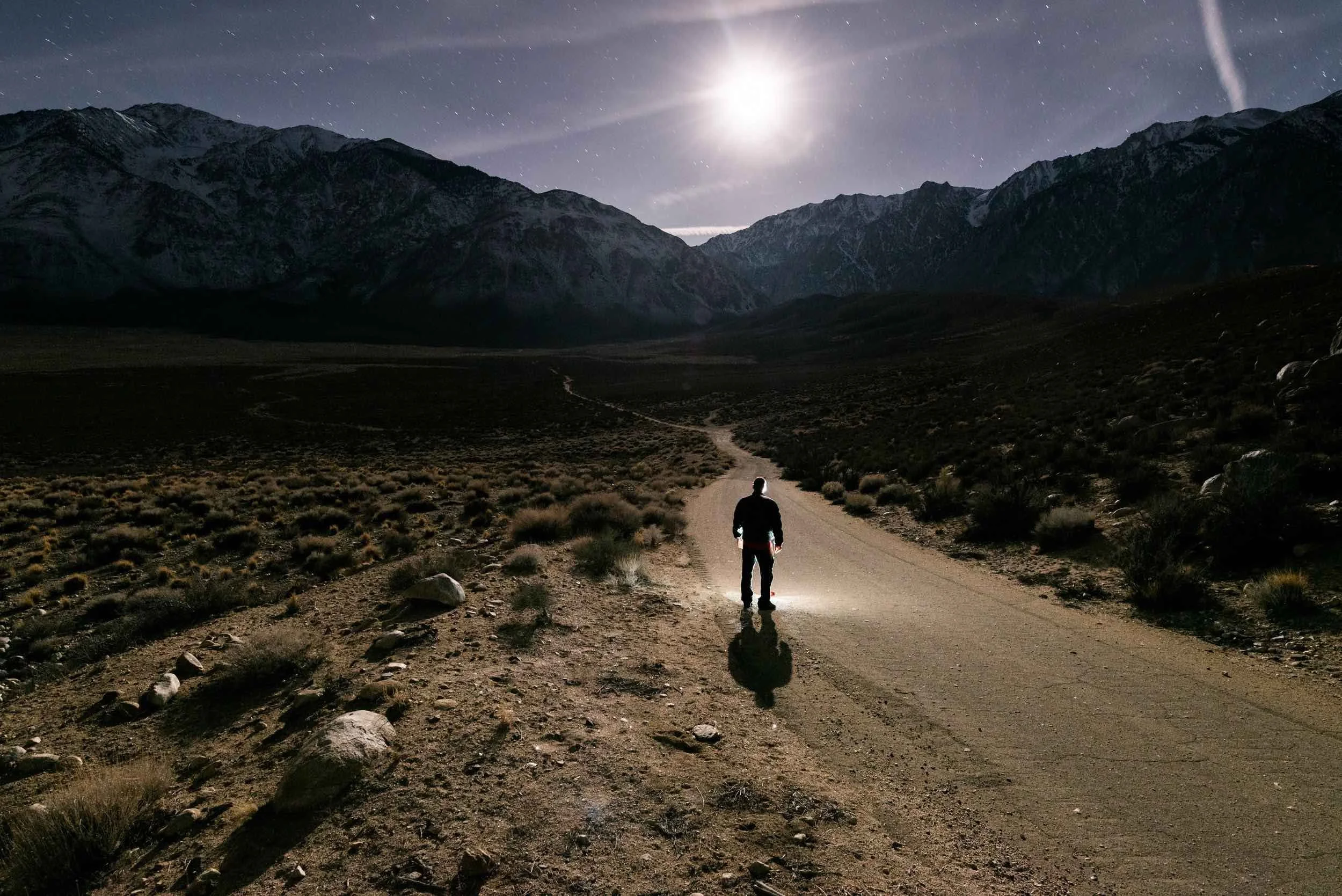Man on a walking path in nature.
