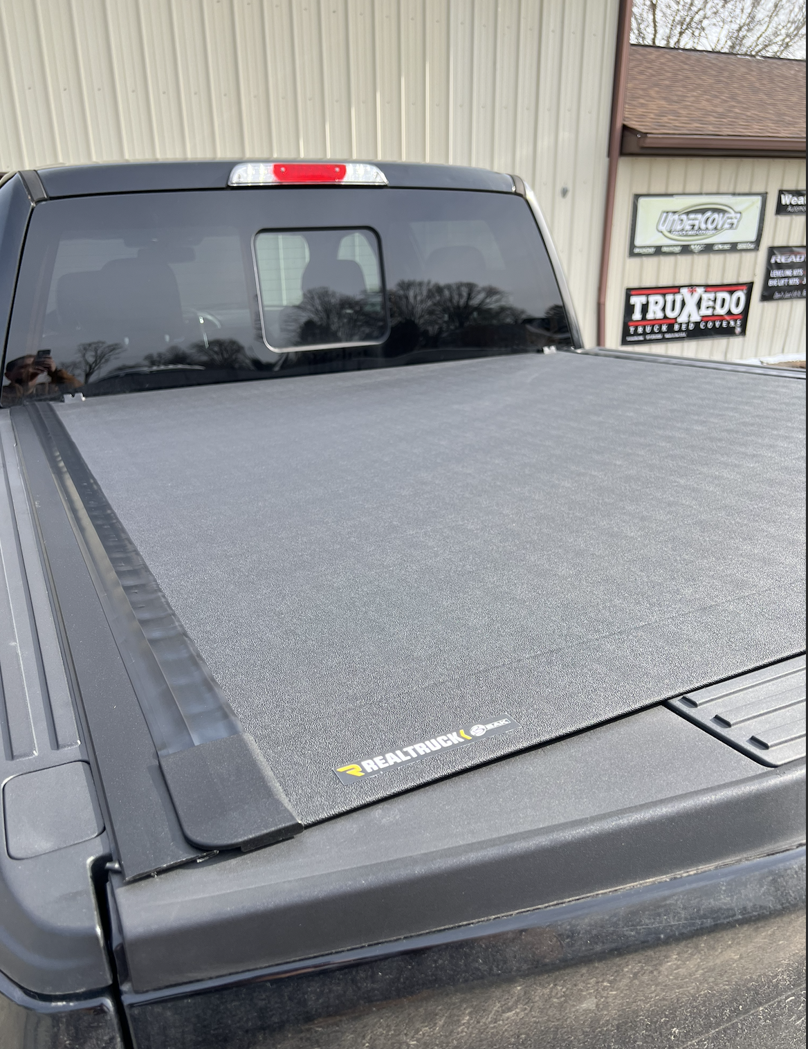Ford F150 with RealTruck hard rolling tonneau cover by BAK.