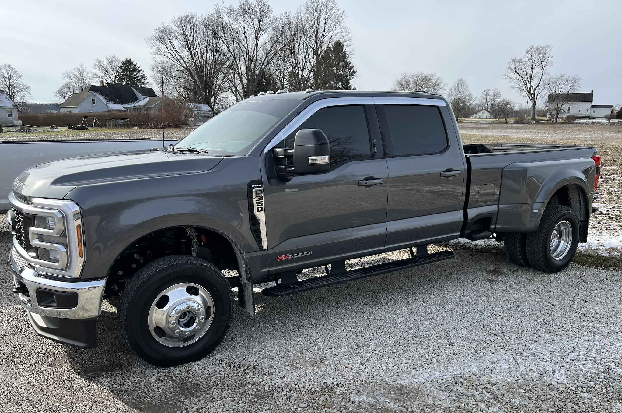 Ford Super Duty with window and windshield tint. Chrome vent visors (rain guards) above the windows. 