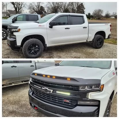 Chevy Silverado Trail Boss with window tint and vent visors (rain guards). Custom LED lights inserted into the grill with a lighted Aeroskin hood skin. 