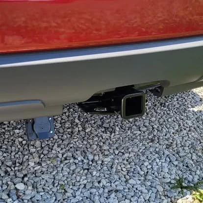 Trailer hitch receiver mounted onto an SUV.