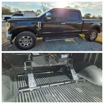 Ford Super Duty with window and windshield tint. Vent visors, or rain guards above the windows and a fifth-wheel hitch mounted in the bed. 