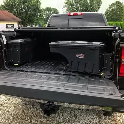 Ford Super Duty bed with spray-in bedliner, rubber bed mat, swing tool boxes and tonneau cover. 