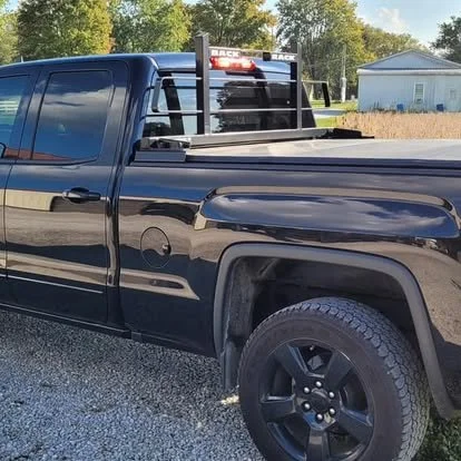 A Back Rack by RealTruck with a hard tri-fold tonneau cover on a Chevy Silverado.