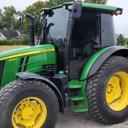 John Deere tractor with window and windshield tint.