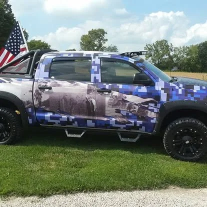 Custom wrapped Toyota Tundra to honor Veterans. Lift kit with off road wheels and tires. LED light bars.