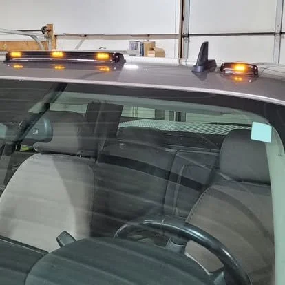 A Chevy/GMC with aftermarket OEM style cab marker lights. 