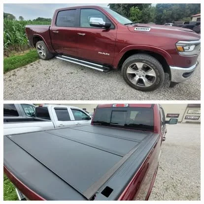 Ram 1500 with custom running boards and a hard tri-fold tonneau cover by Real Truck.