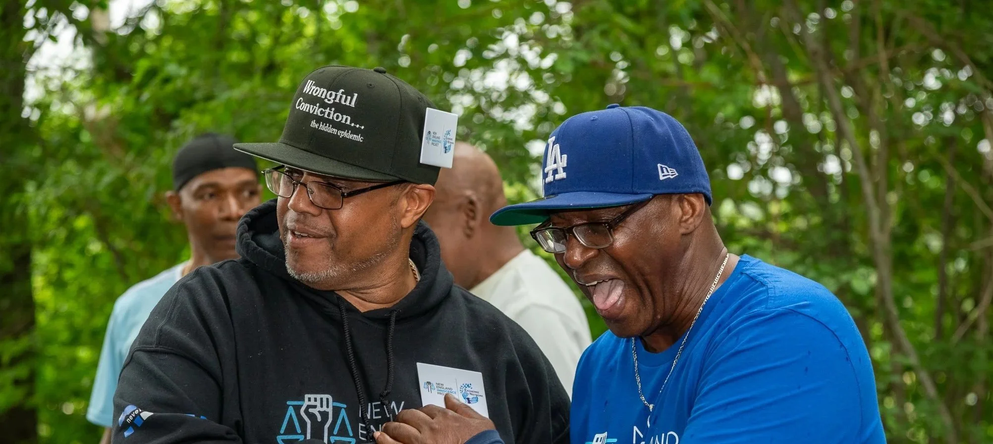Two community members laughing together