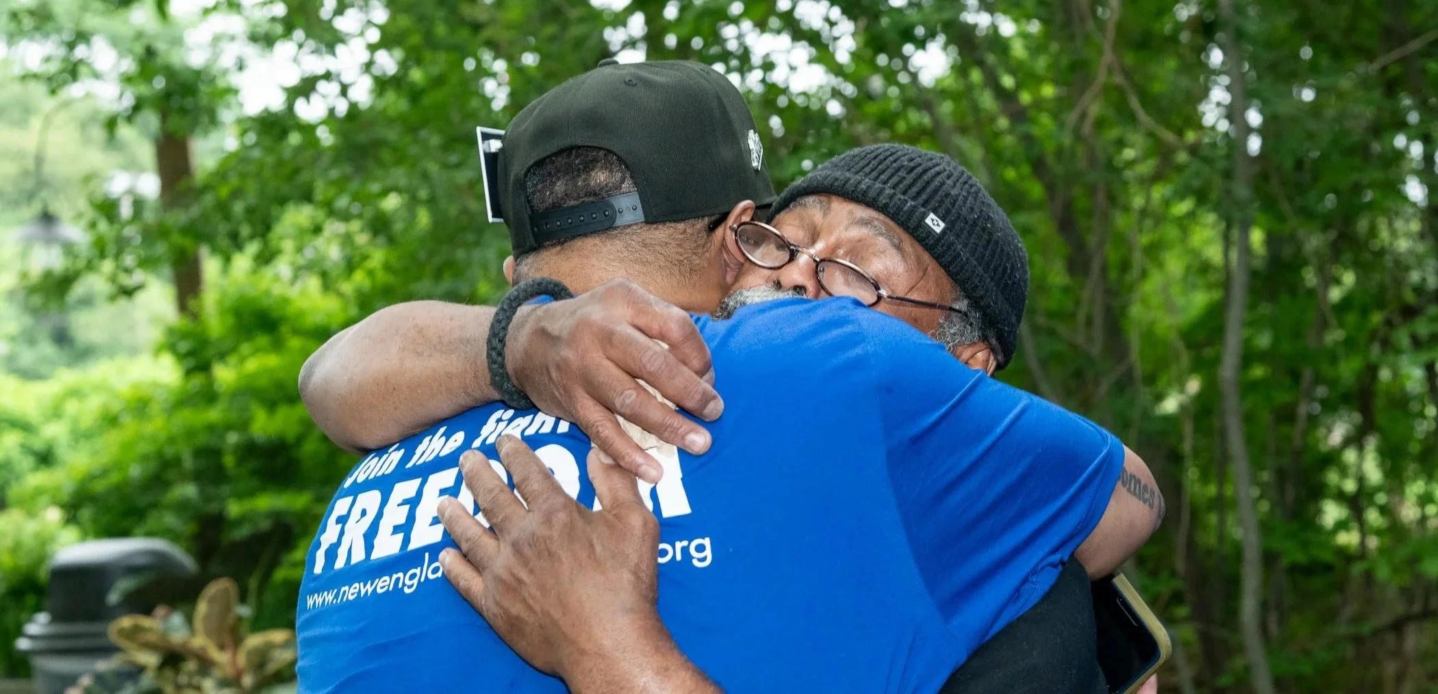 Two community members hugging