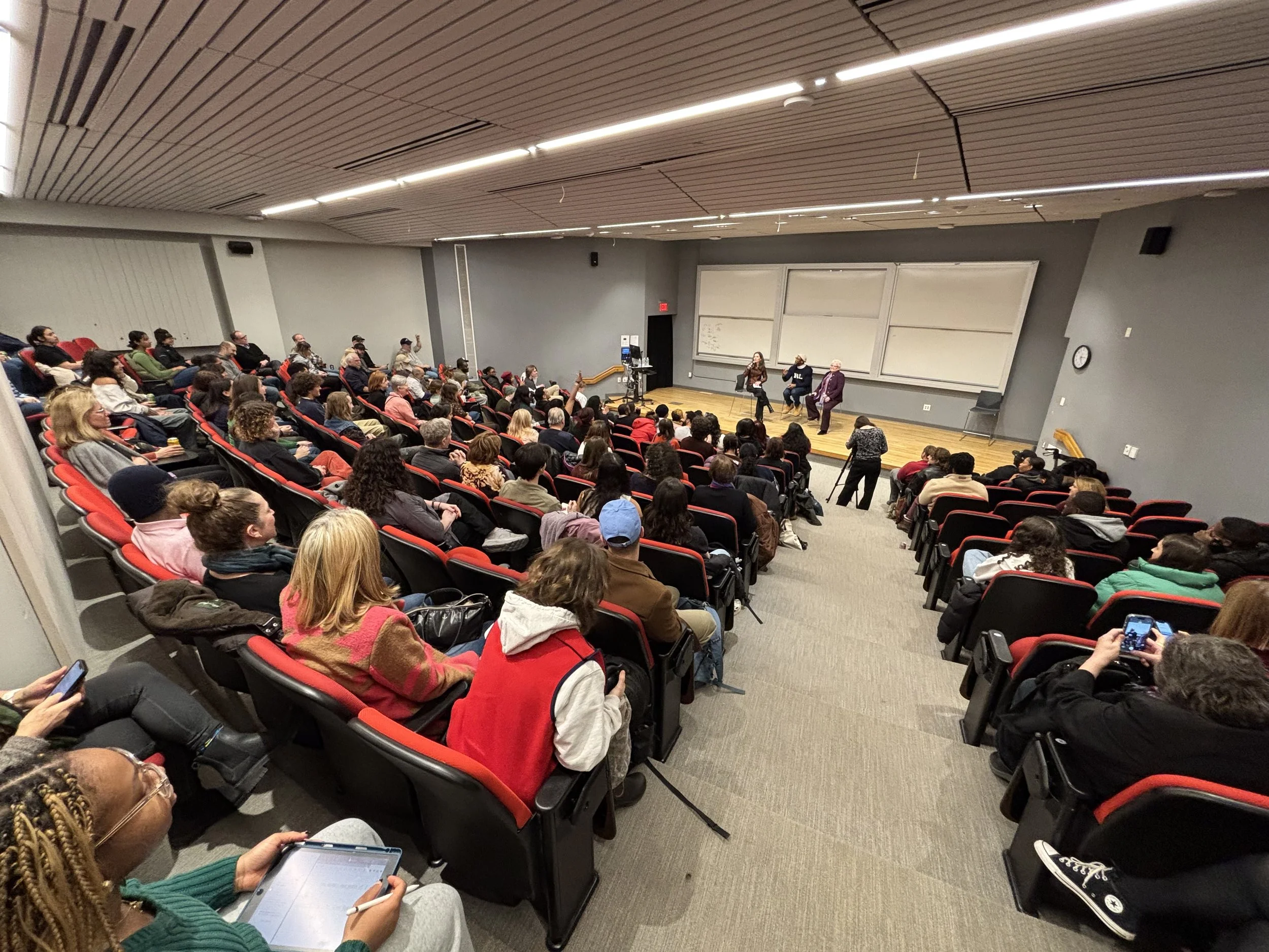 Tufts University audience listening to speakers