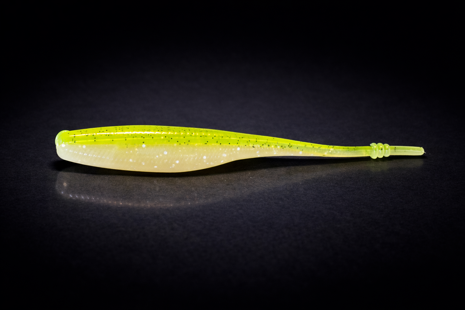 Fishing lure on black surface.png