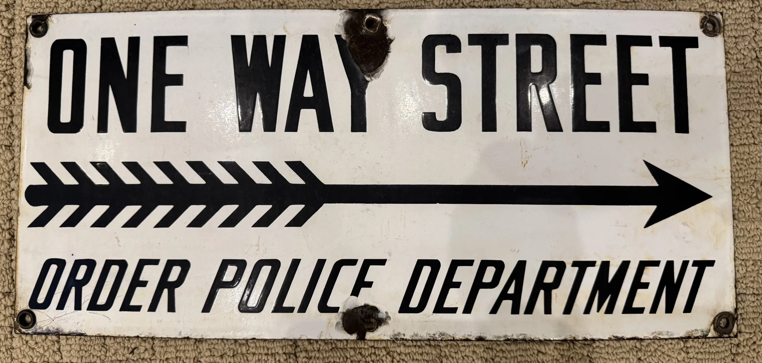 Very early, rare "One Way Street" by "Order Police Department" porcelain single sided sign with an arrow pointing to the right.  Highly desirable and collectable sign. 