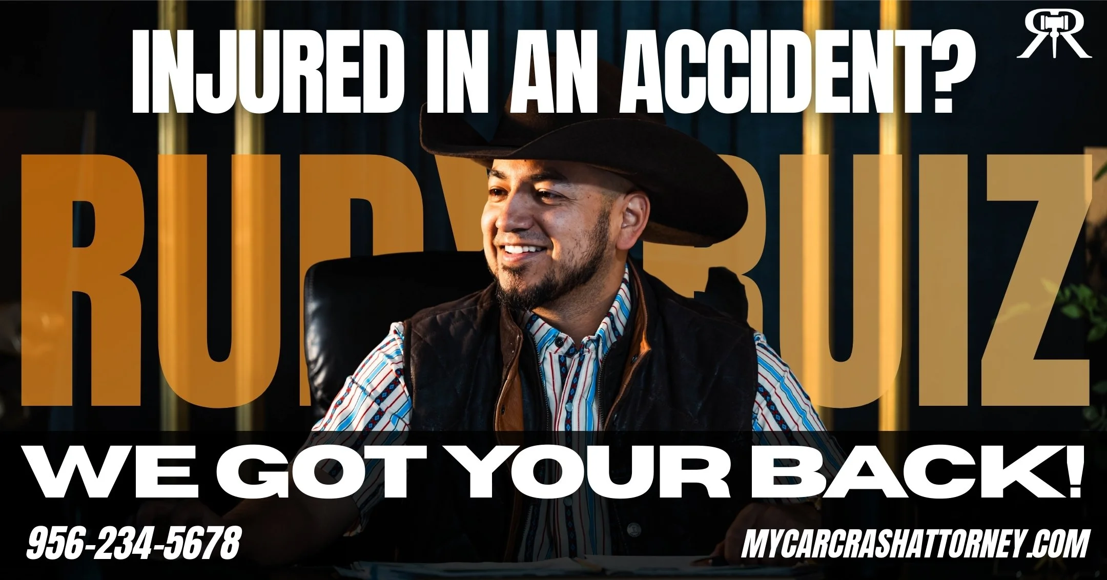 Smiling man in cowboy hat and plaid shirt sitting at desk with text overlay about being injured in a car accident, including phone number and website.