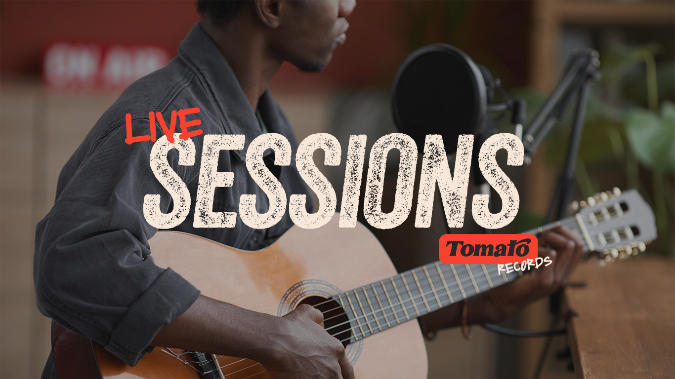 Person playing acoustic guitar with microphone in a studio setting, promotional overlay for live sessions by Tomato Records.