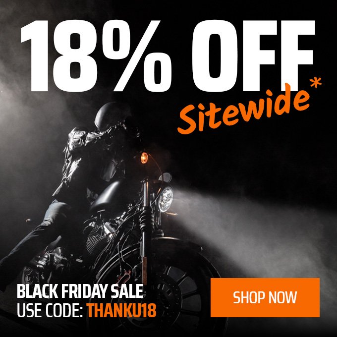 Dark background with a motorcyclist in leather gear riding a black motorcycle, promoting an 18% off sitewide sale for Black Friday, with an orange 'Shop Now' button and discount code THANKU18.
