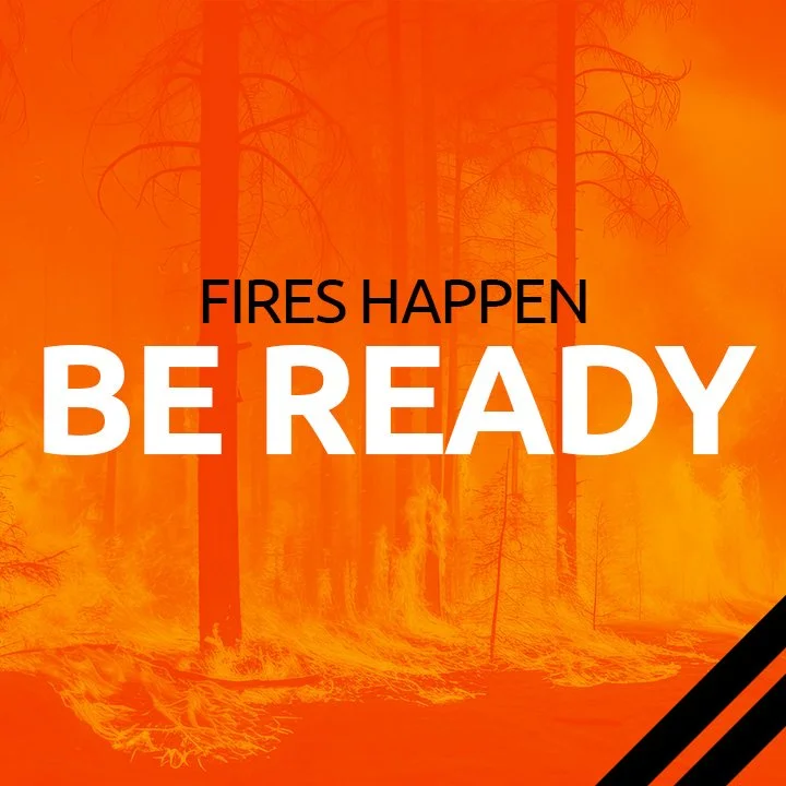 Forest on fire with orange flames and smoke, overlaid with the text "Fires happen be ready" in bold black and white letters.