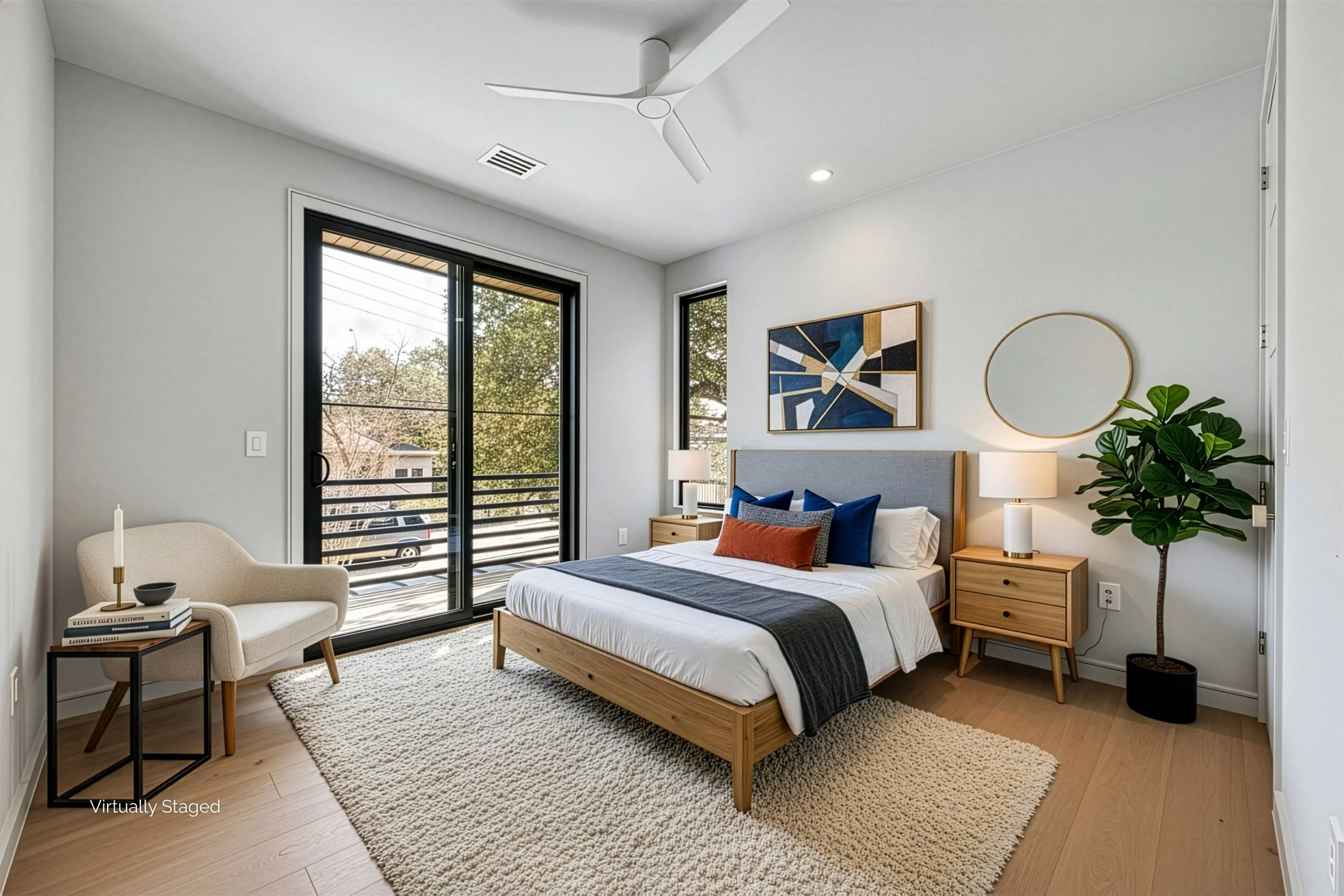 Modern bedroom with large sliding glass door leading to balcony, bed with wooden frame and gray upholstered headboard, abstract wall art, bedside tables with lamps, potted plant, and cozy rug.