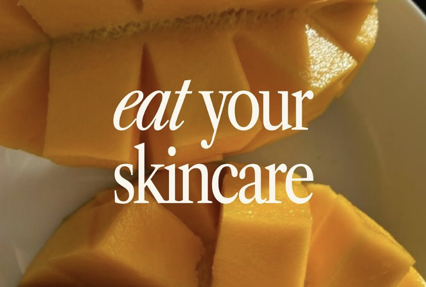 Close-up of fresh sliced mango with text overlay saying 'eat your skincare'.