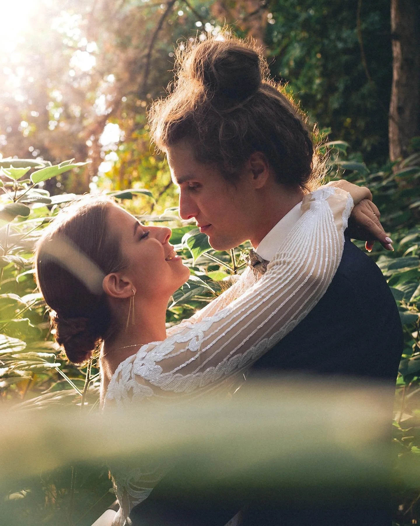 A beautiful couple amidst green foliage. 🪷Love in full bloom.