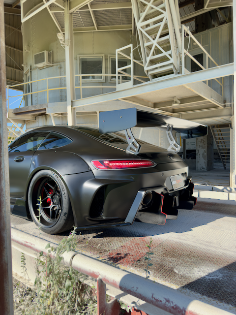 Full satin black wrpped widebody Mercedes AMG GT with custom wheels.