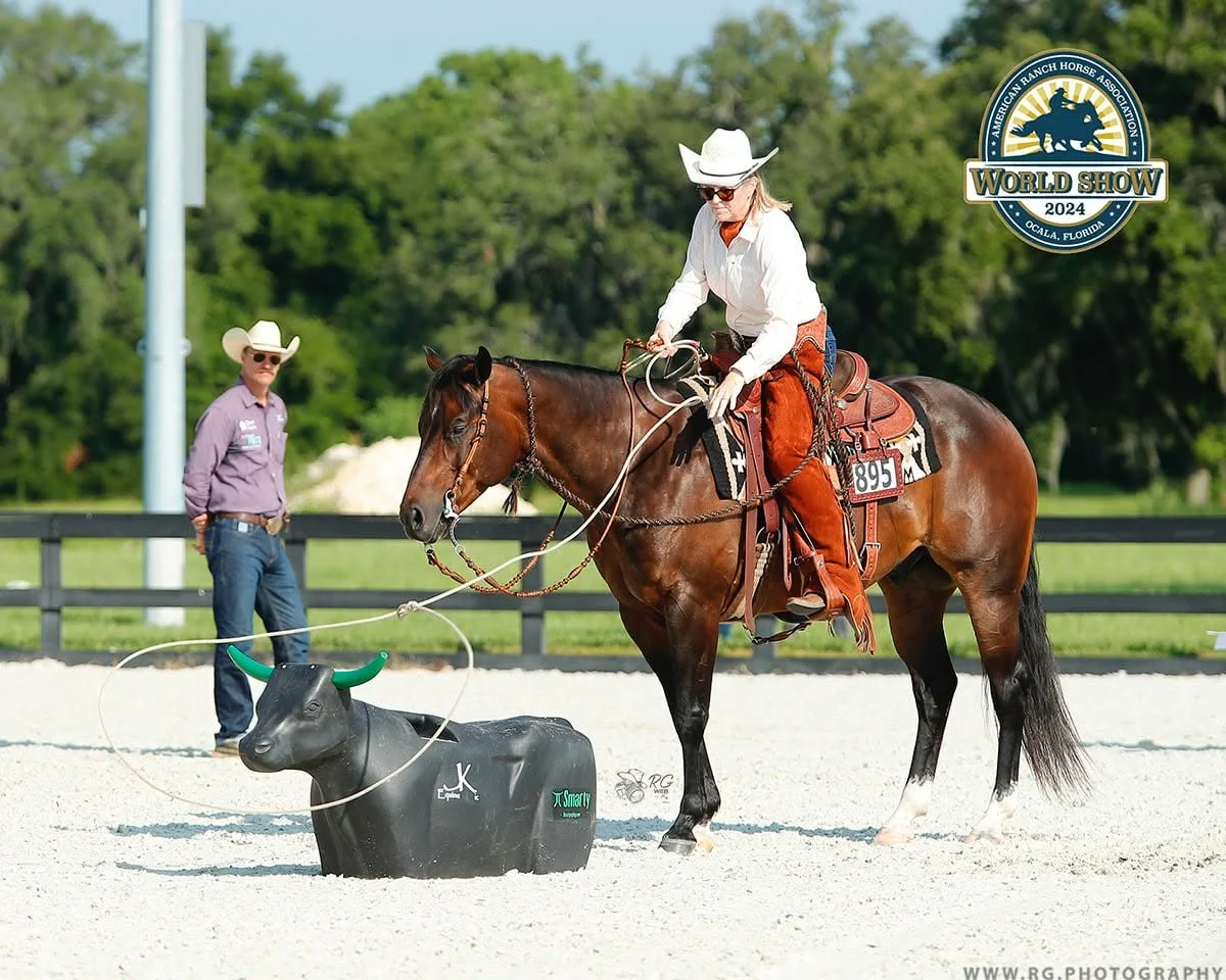 Julie and Reno roping a dummy during competition.