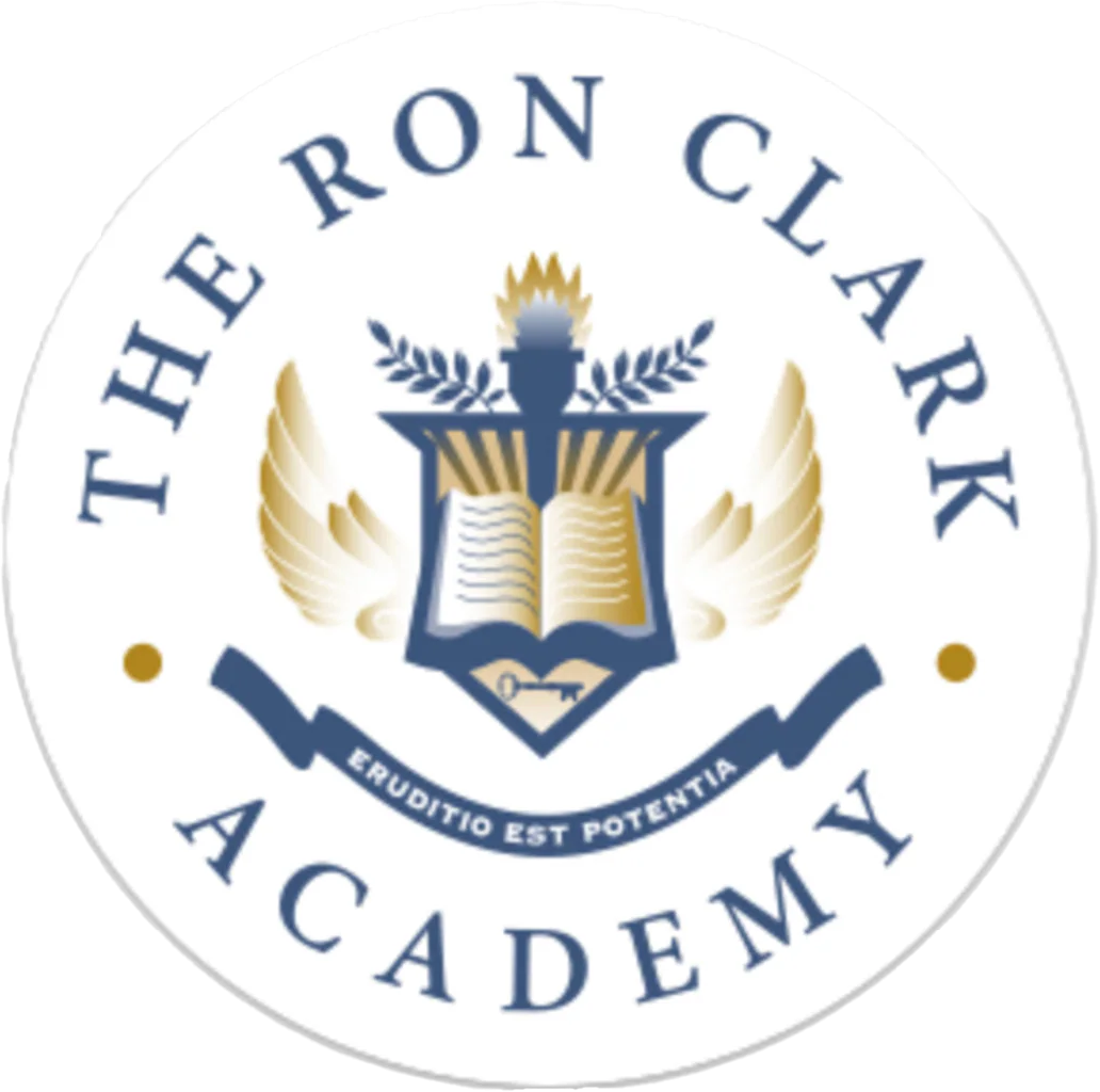 Logo of The Ron Clark Academy featuring an open book, a torch, wings, and a banner with Latin text, all encircled by the academy's name.