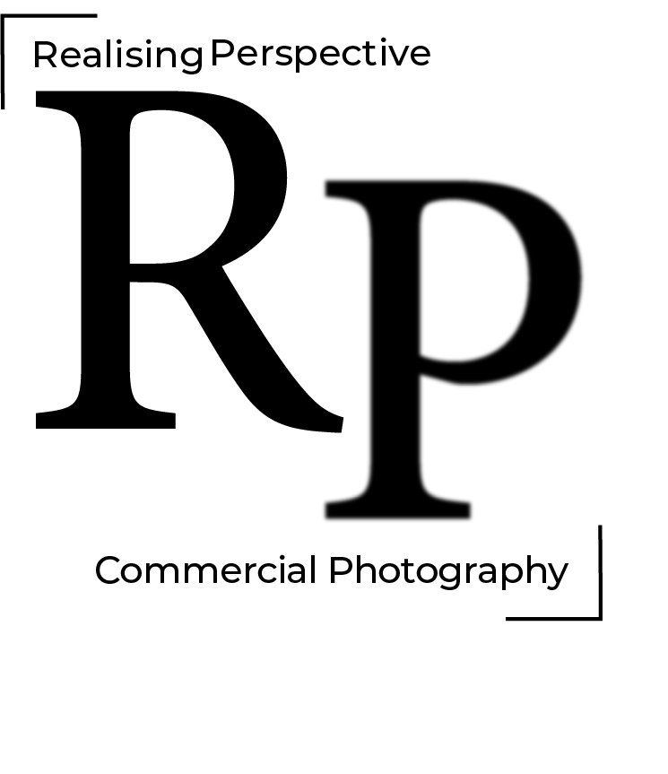 Close-up of a black camera lens with the letter D on the side