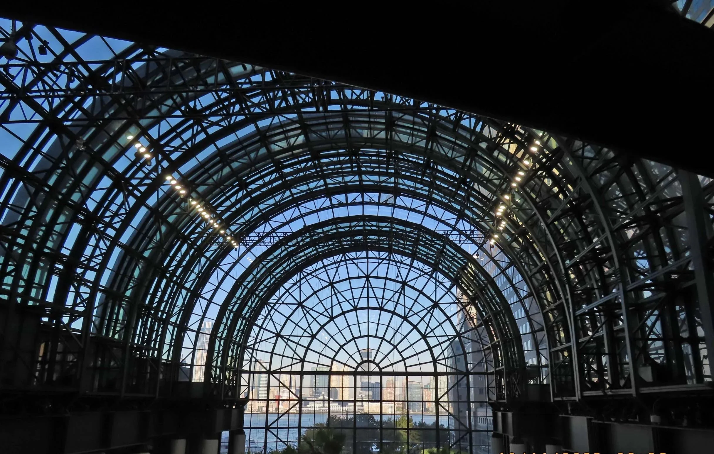 Picture of large, rounded glass ceiling in open atrium. 