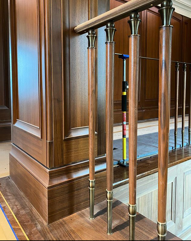 Prior fabrication experience.
Walnut wall panels and stair spindles with metal detailing by Drabek Technologies Ltd.