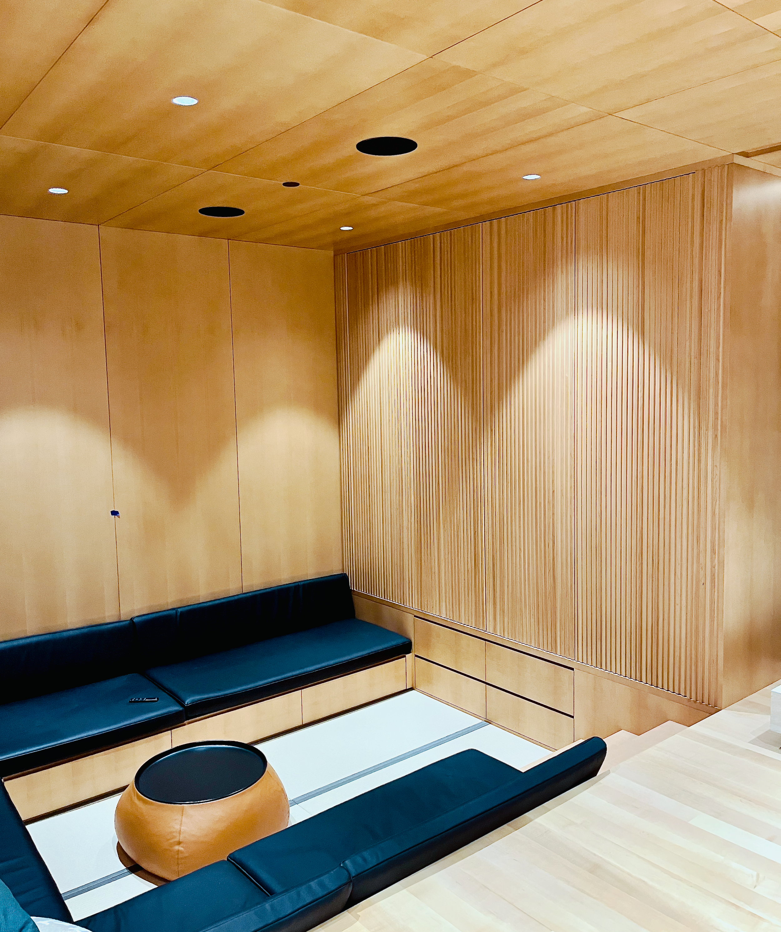 Prior fabrication experience.
Sunken media pit with concealed bifold pocket doors in stained maple.