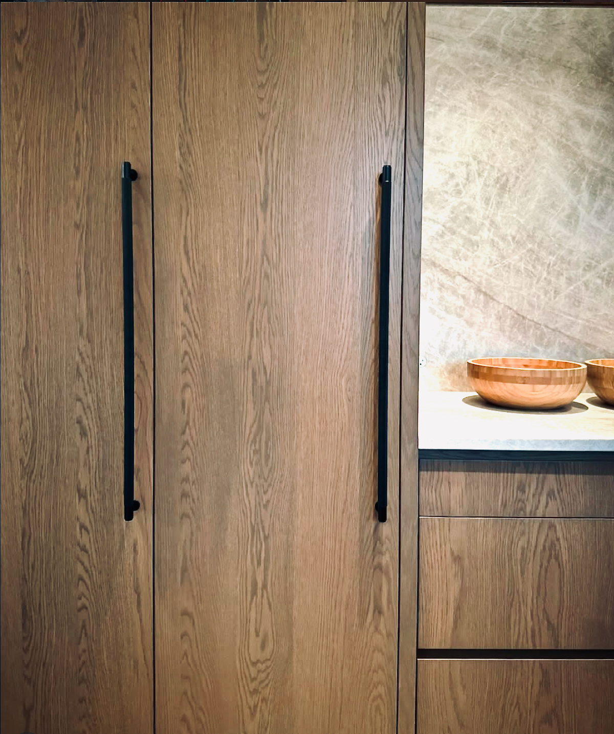 Prior fabrication experience.
Stained oak kitchen with full-height storage.