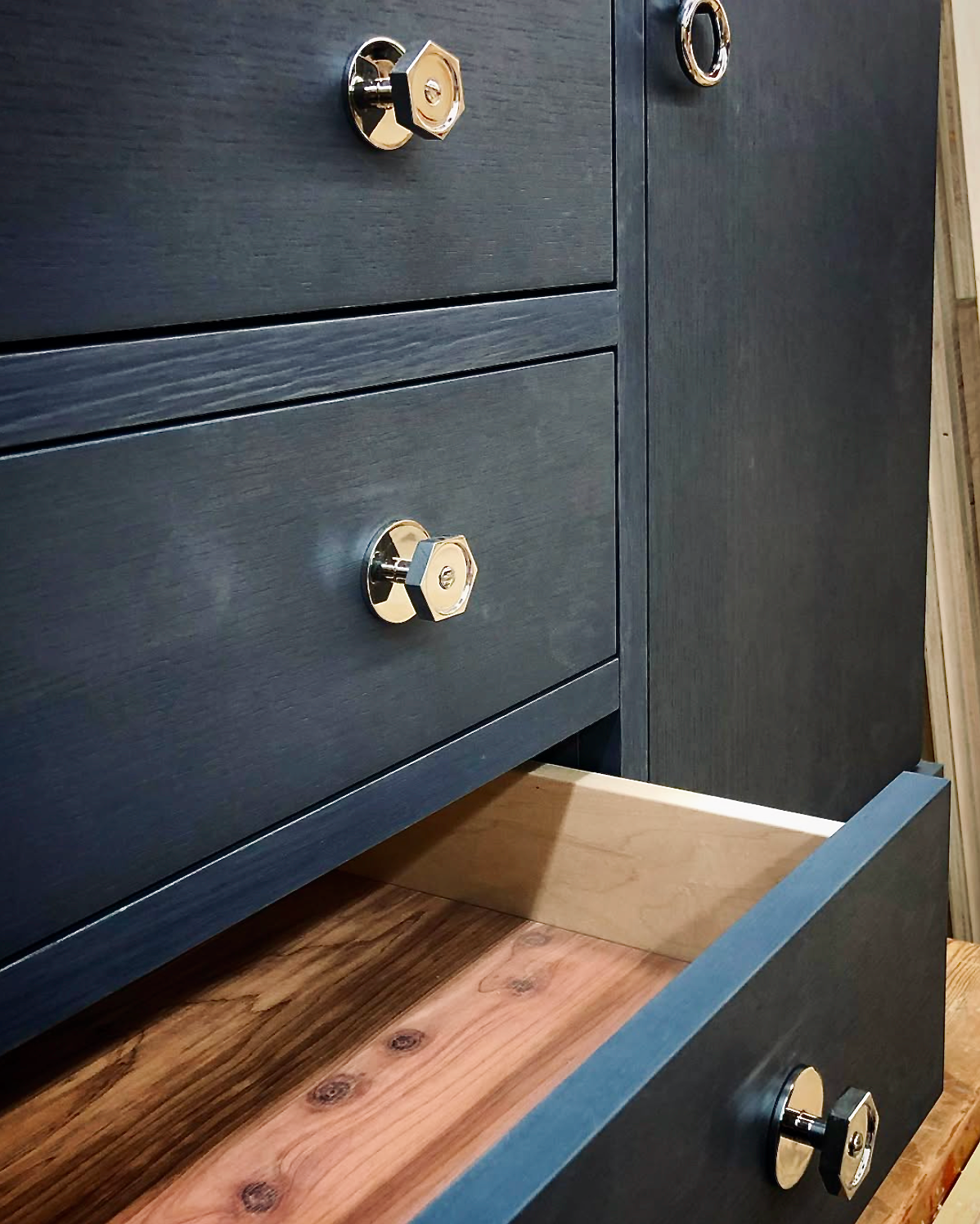 Prior fabrication experience.
Stained oak console cabinet with cedar drawer boxes and polished hardware.
