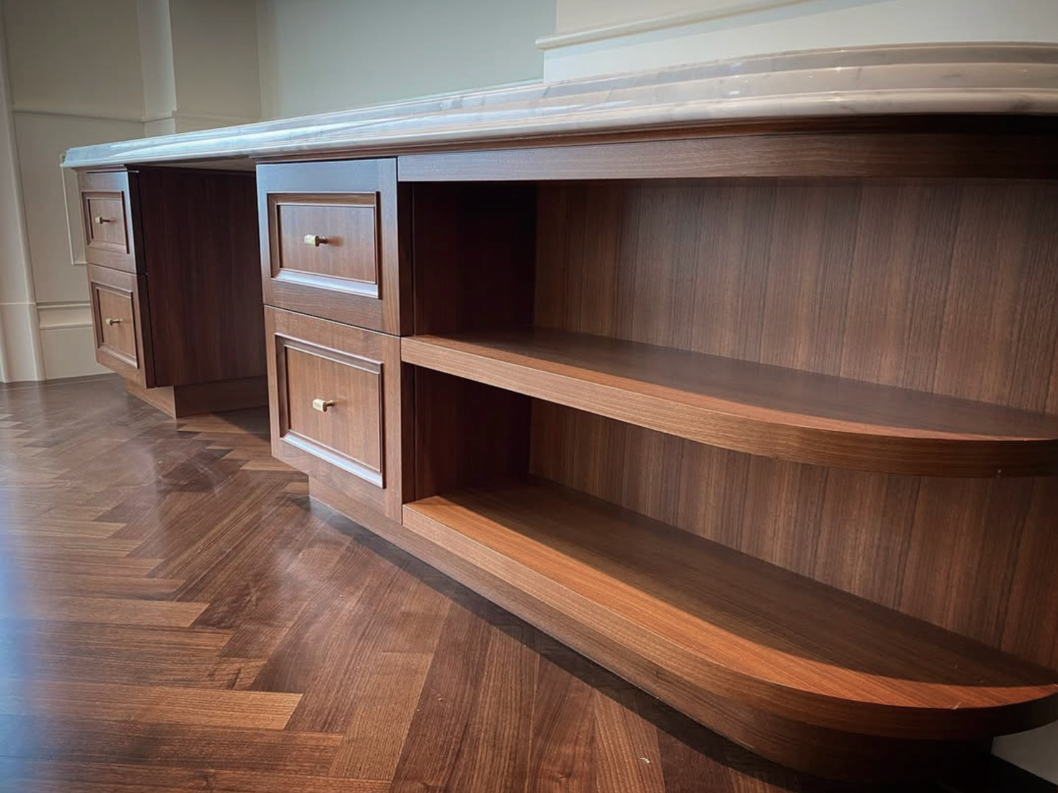 Prior fabrication experience.
Custom walnut built-in desk with drawers and open shelving in a Vancouver home.