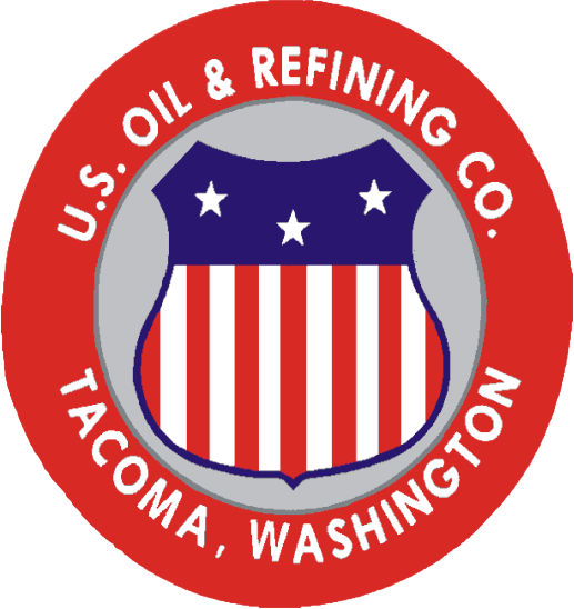 Logo of U.S. Oil & Refining Co. featuring a shield with stars and stripes, surrounded by a red circle with white text that reads 'U.S. Oil & Refining Co. Tacoma, Washington.'