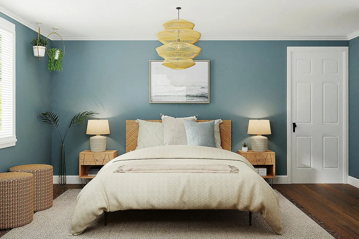 A bedroom with blue walls, a wooden bed with white bedding, two matching nightstands with lamps, a framed picture above the bed, hanging plants, and a textured rug on hardwood flooring.